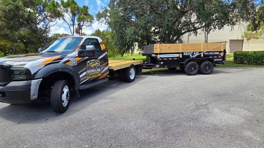Ironclad Hauling flatbed truck and dump trailer in Broward County, Florida